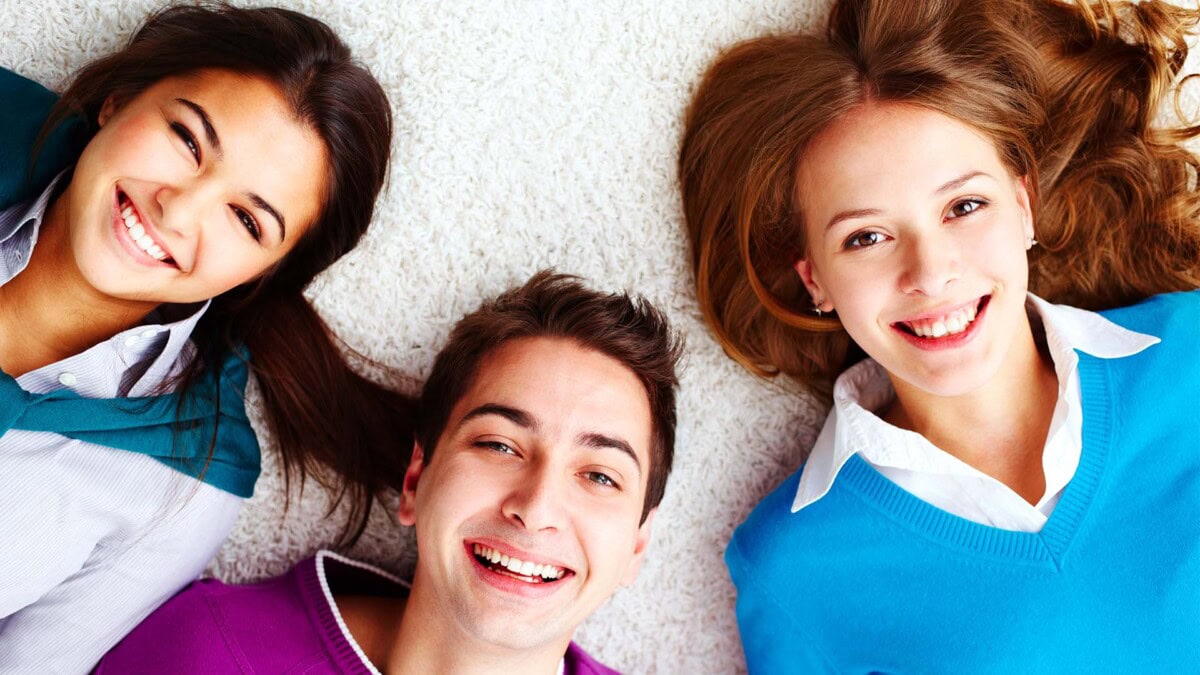 Young people smiling at camera